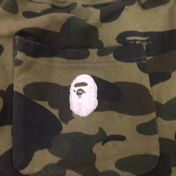 A BATHING APE GREEN 1ST CAMO SWEATS W/ EMBROIDERED LETTERS IN WHITE SZ. M
